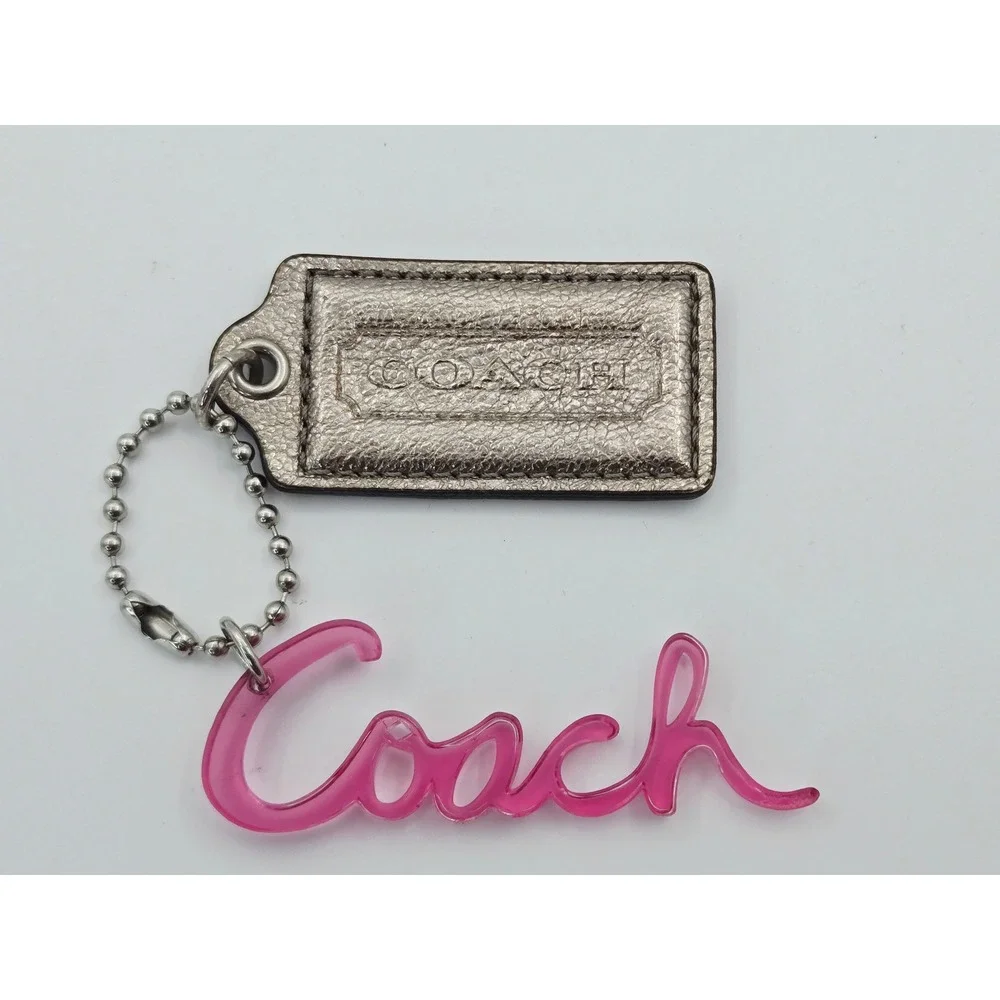 Coach POPPY Metallic Silver Leather Hangtag Pink Acrylic Script Logo Bag Charm
